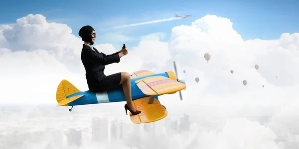 Woman in drawn airplane . Mixed media — Stock Photo, Image