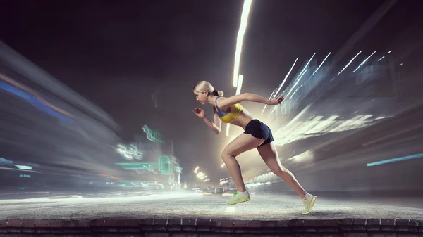 Young woman jogger . Mixed media — Stock Photo, Image