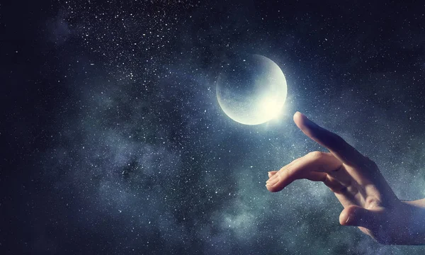 Місячна планета в руці. Змішані носії — стокове фото