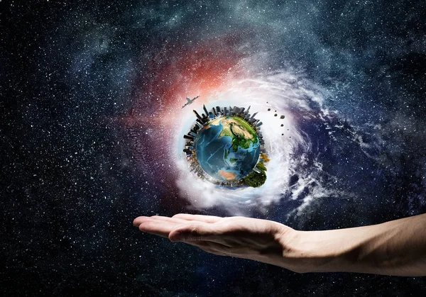 Planet earth in hand . Mixed media — Stock Photo, Image