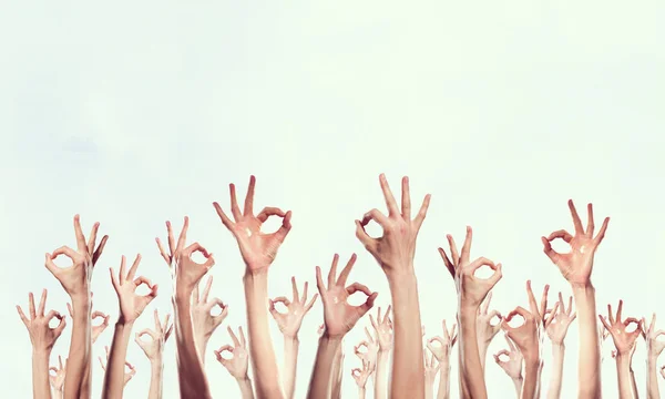 Group of people rise hands . Mixed media — Stock Photo, Image