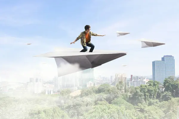 Hipster guy surfing sky. Mixed media — Stockfoto
