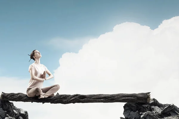 Girl practicing yoga . Mixed media — Stock Photo, Image