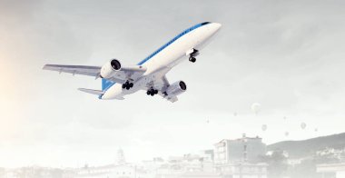 Uçak gün gökyüzünde. Karışık teknik