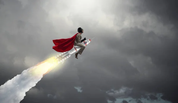 Woman riding missile. Mixed media — Stock Photo, Image