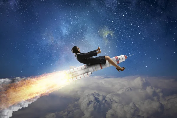 Woman riding missile. Mixed media — Stock Photo, Image