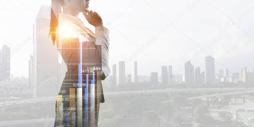 Thoughtful businesswoman with hand on chin