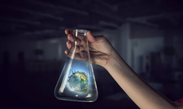 Globe in glass tube . Mixed media — Stock Photo, Image