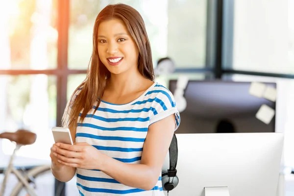 Young woman in office — Stock Photo, Image