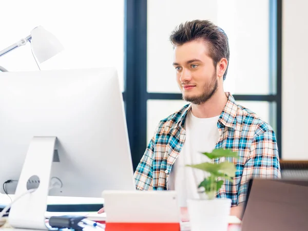 Young man working in office — Stock Photo, Image