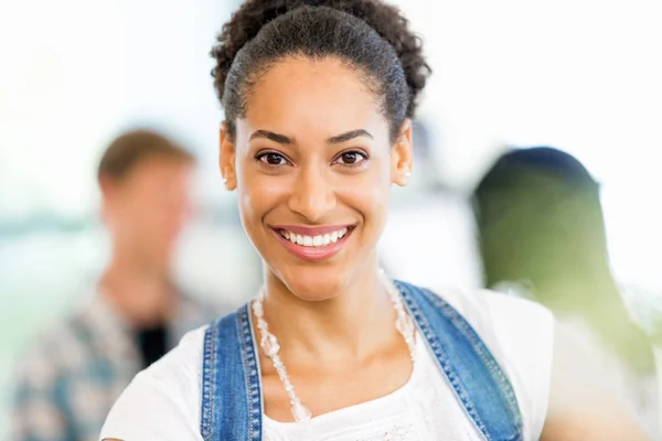 Portrait of smiling afro-american office worker sitting in offfice — Stock Photo, Image