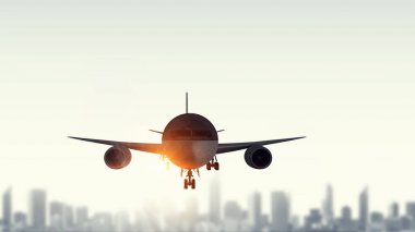 Cityscape üzerinde yolcu uçağı