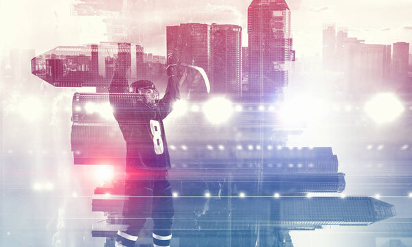 Double exposure image of hockey players and modern city