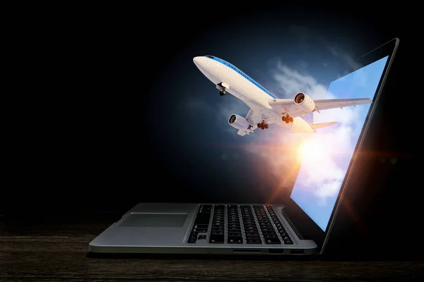 Vliegtuig in laptop scherm. Mixed media — Stockfoto