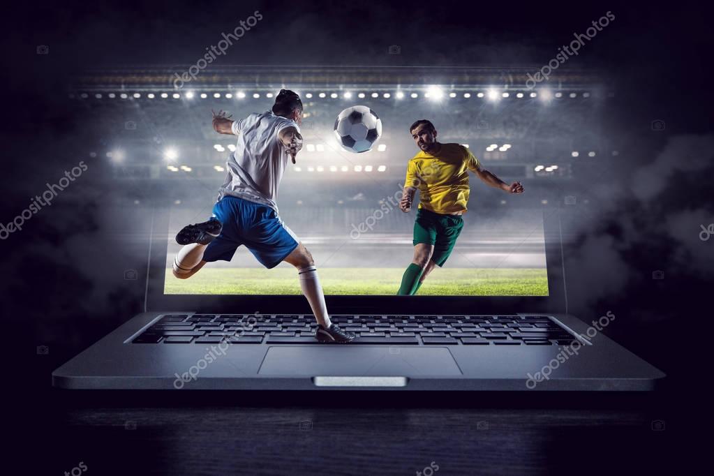 Football player at stadium fighting for ball. Mixed media