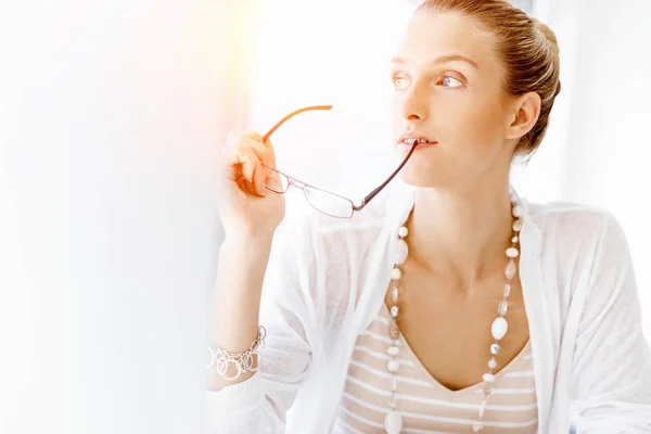 Attractive office worker sitting at desk — Stock Photo, Image