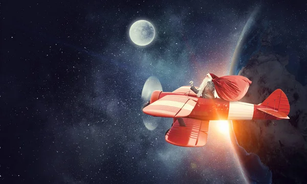 Santa hediyeler teslim için aceleyle. Karışık teknik