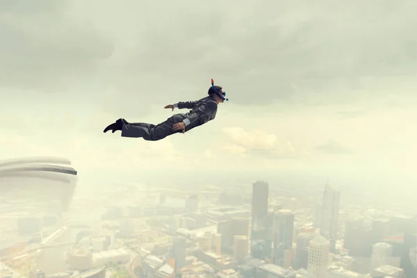 Businessman diving from top . Mixed media . Mixed media — Stock Photo, Image