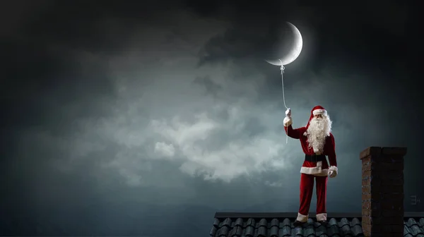 Santa catch the moon — Stock Photo, Image