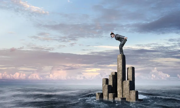 Businessman diving from top . Mixed media — Stock Photo, Image