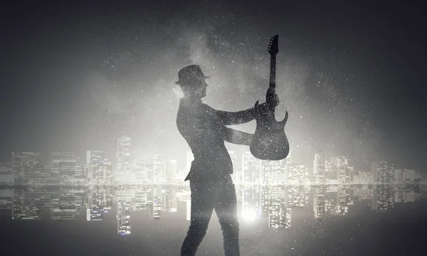 Rockový chlápek s kytarou. Kombinovaná technika — Stock fotografie