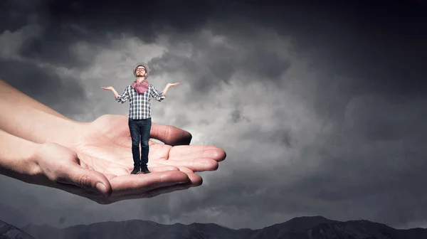 Hipster guy in male hands — Stock Photo, Image