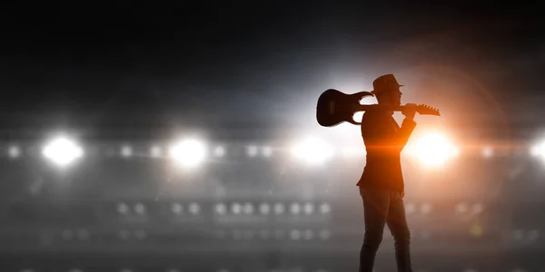 Rock guy with guitar. Mixed media — Stock Photo, Image