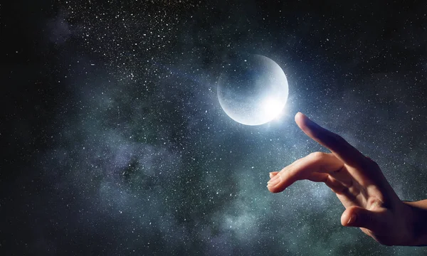 Hand touching the moon — Stock Photo, Image