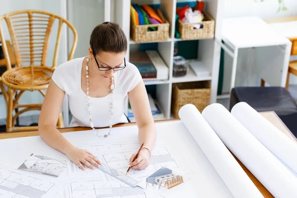 Young woman architect in office — Stock Photo, Image