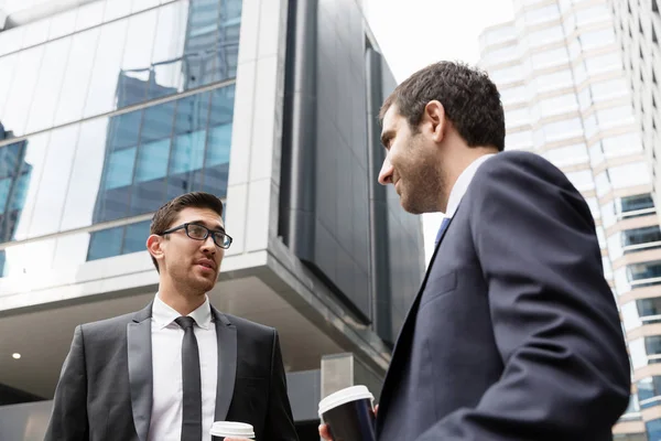 Young businessmen with a bike — Stock Photo, Image