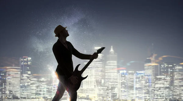 Rockový chlápek s kytarou. Kombinovaná technika — Stock fotografie