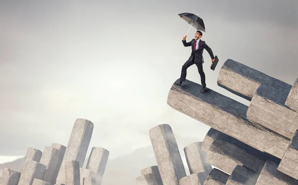 Elegant banker with umbrella. Mixed media — Stock Photo, Image