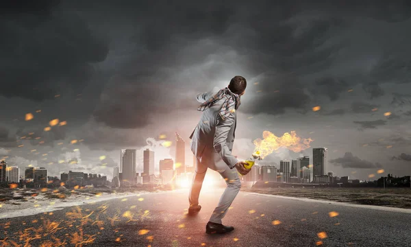 Businessman throwing petrol bomb — Stock Photo, Image