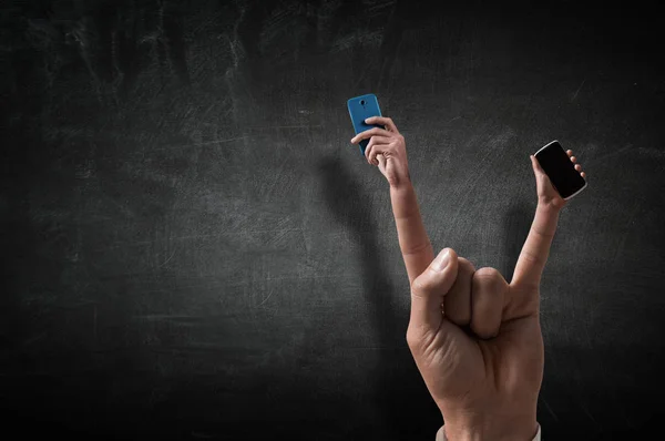 Rock gesture on concrete background . — Stock Photo, Image