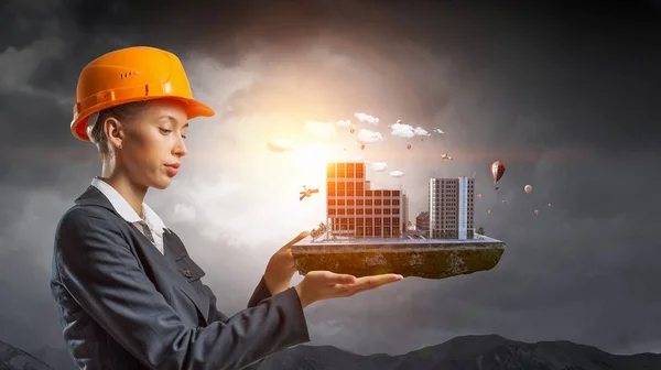 Woman presenting construction project. Mixed media — Stock Photo, Image