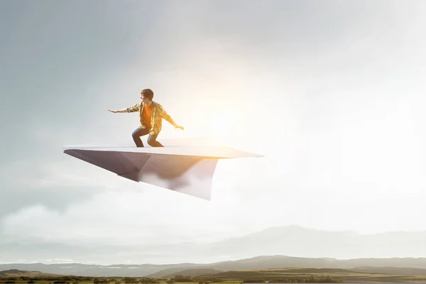 Hipster guy surfing sky. Mixed media — Stockfoto