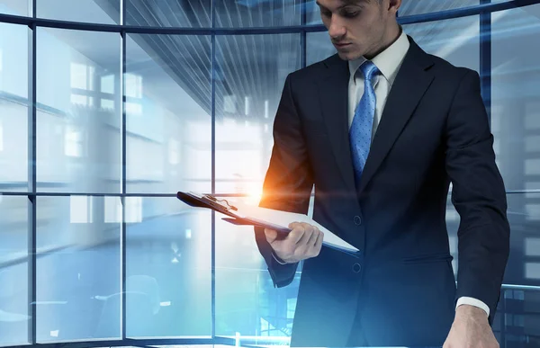 Elegant businessman at work. Mixed media — Stock Photo, Image