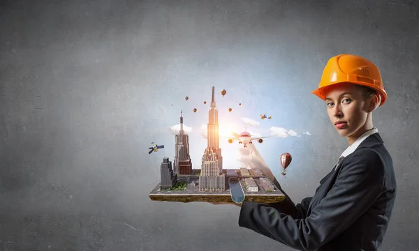 Woman presenting construction project. Mixed media — Stock Photo, Image