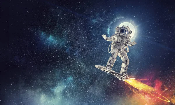 Spaceman on flying board. Mixed media — Stock Photo, Image