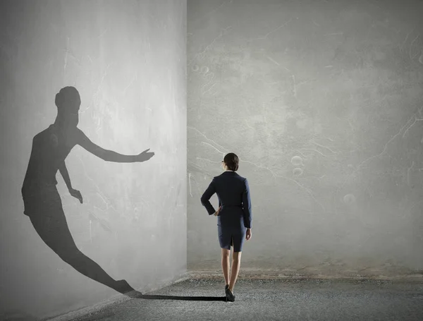 Businesswoman in empty room . Mixed media — Stock Photo, Image