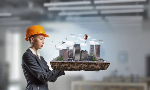 Woman presenting construction project. Mixed media — Stock Photo, Image