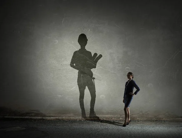 Businesswoman in empty room . Mixed media — Stock Photo, Image