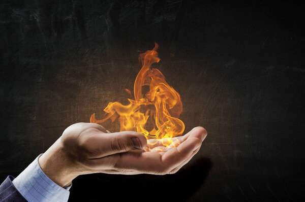 Fire burning in his hands