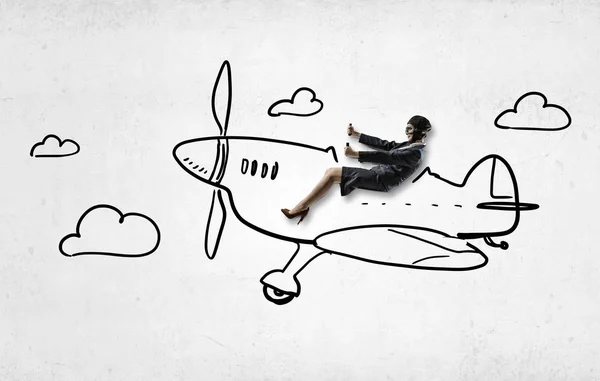 Woman in drawn airplane . Mixed media — Stock Photo, Image