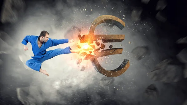 Karate man aanval euro. Mixed media — Stockfoto