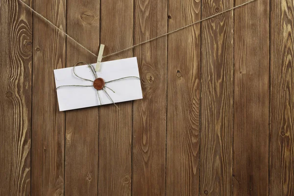 Envelope pinned to rope — Stock Photo, Image