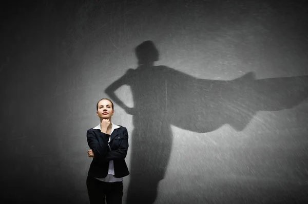 Businesswoman in empty room . Mixed media — Stock Photo, Image