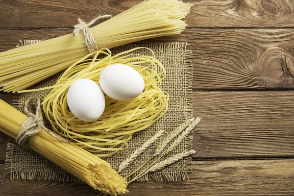 Dry pasta on table — Stock Photo, Image