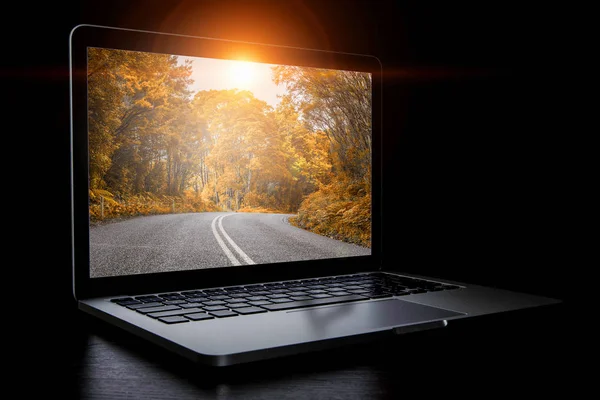 Laptop with picture on screen. Mixed media — Stock Photo, Image