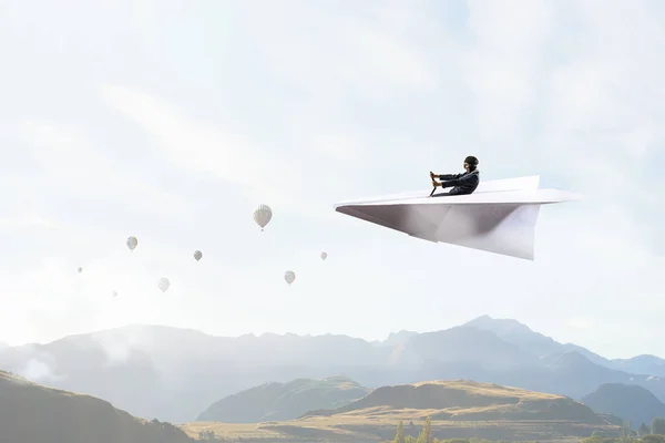 Woman pilot in paper plane. Mixed media — Stock Photo, Image